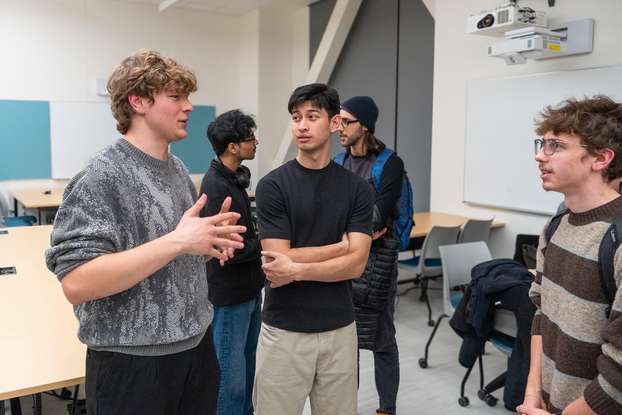 A small group talking together in a classroom