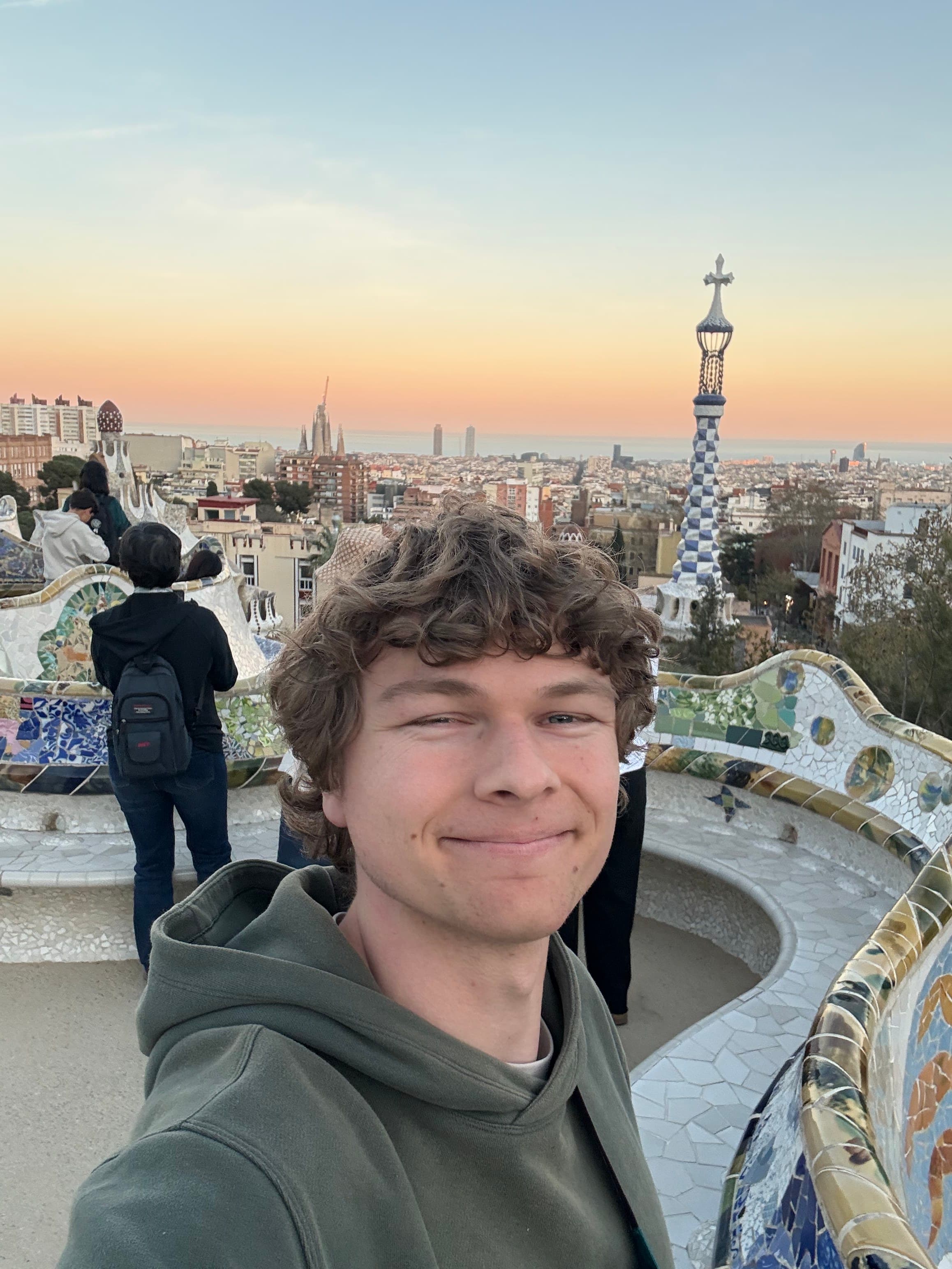 Aidan overlooking Barcelona from Park Güell at sunset